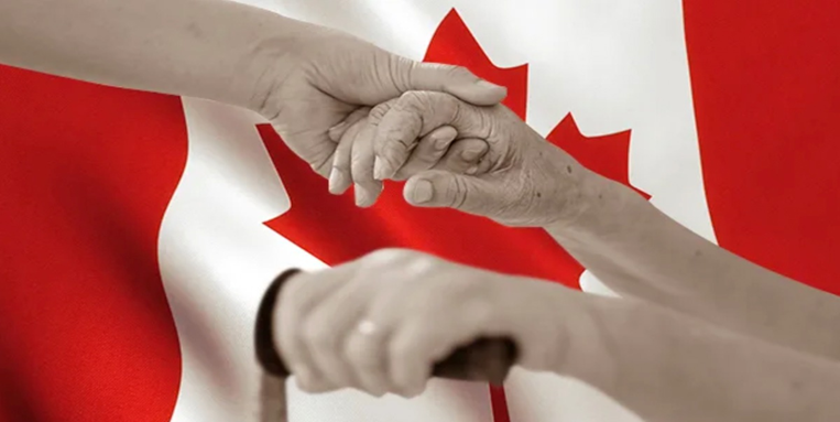 Hands holding in front of a Canadian flag