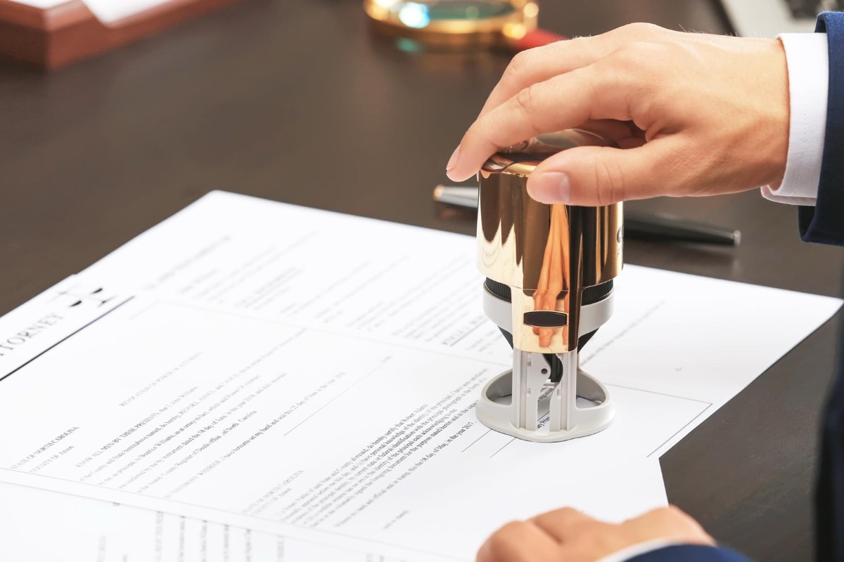 Notary stamping a legal document at a law office in Toronto